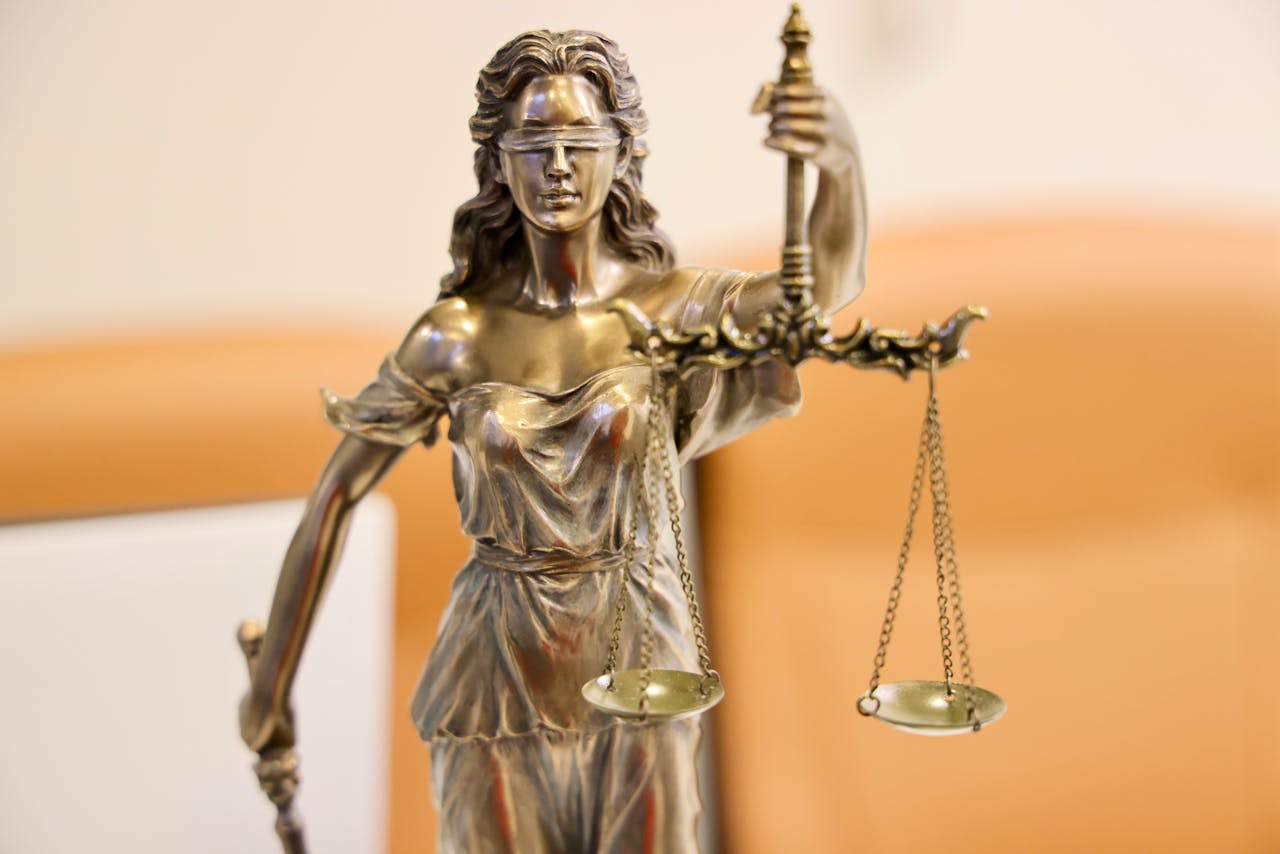 our-journey-03 Detailed image of Lady Justice statue, symbolizing fairness and impartiality.
